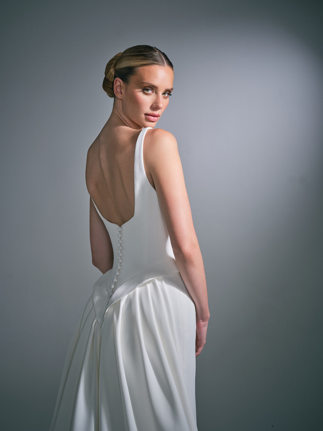 Close-up of the Celiane gown bodice, highlighting the detailed hand-draping and structured corsetry.
