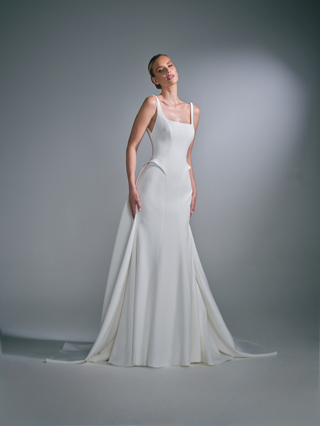 Full-length front view of the Celiane wedding dress by Suzanne Neville from the ICON 35 collection, featuring a sculpted silhouette.